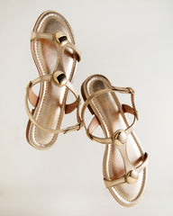 Italian-made women's flat gold leather sandal with gold accents, affordable luxury footwear for everyday elegance