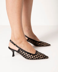 Bianca Buccheri Hannah black lattice slingback heels on foot, three-quarter side view