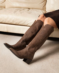Alpaca Boot brown suede Western boot — close-up of Italian suede texture and authentic Texan contrast stitching detail / Bianca Buccheri Alpaca cowboy boot styled with midi dress — lifestyle shot