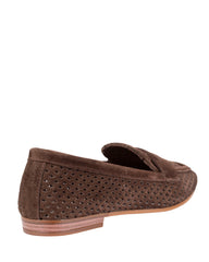 Dolci Firme Keah chocolate suede penny loafer, three-quarter rear view on a natural stacked sole