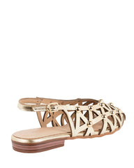 Close-up of the geometric laser-cut lattice and gold dome studs on the Dolci Firme Luana gold slingback flat