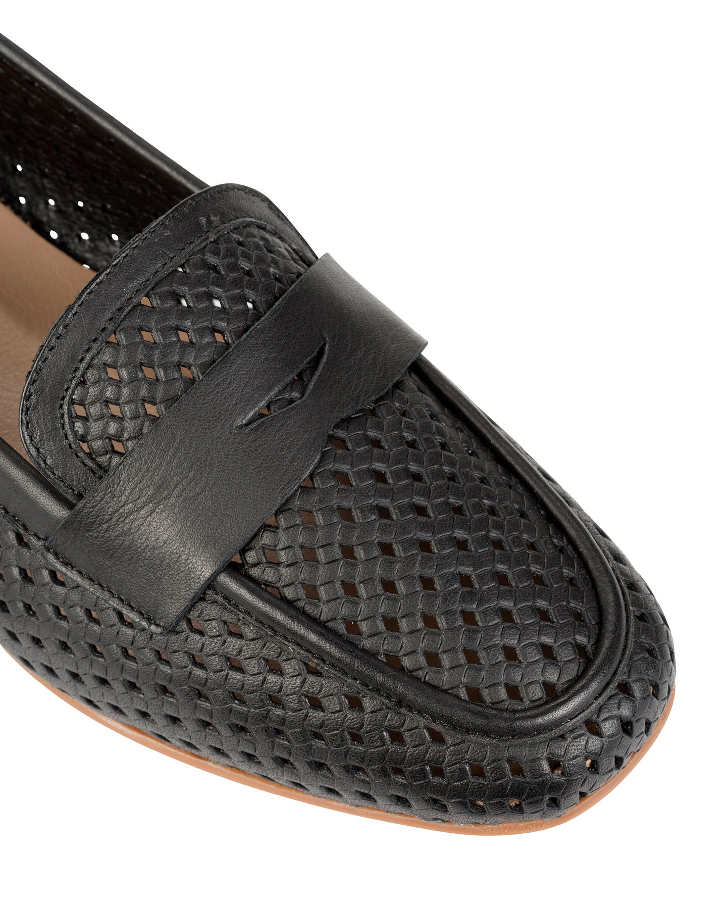 Close-up of the woven leather upper and leather penny keeper on the Dolci Firme Keah black loafer