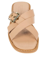 Dolci Firme Lilla nude leather slide, top view showing the crossover straps, gold squared buckle and studded sole edge