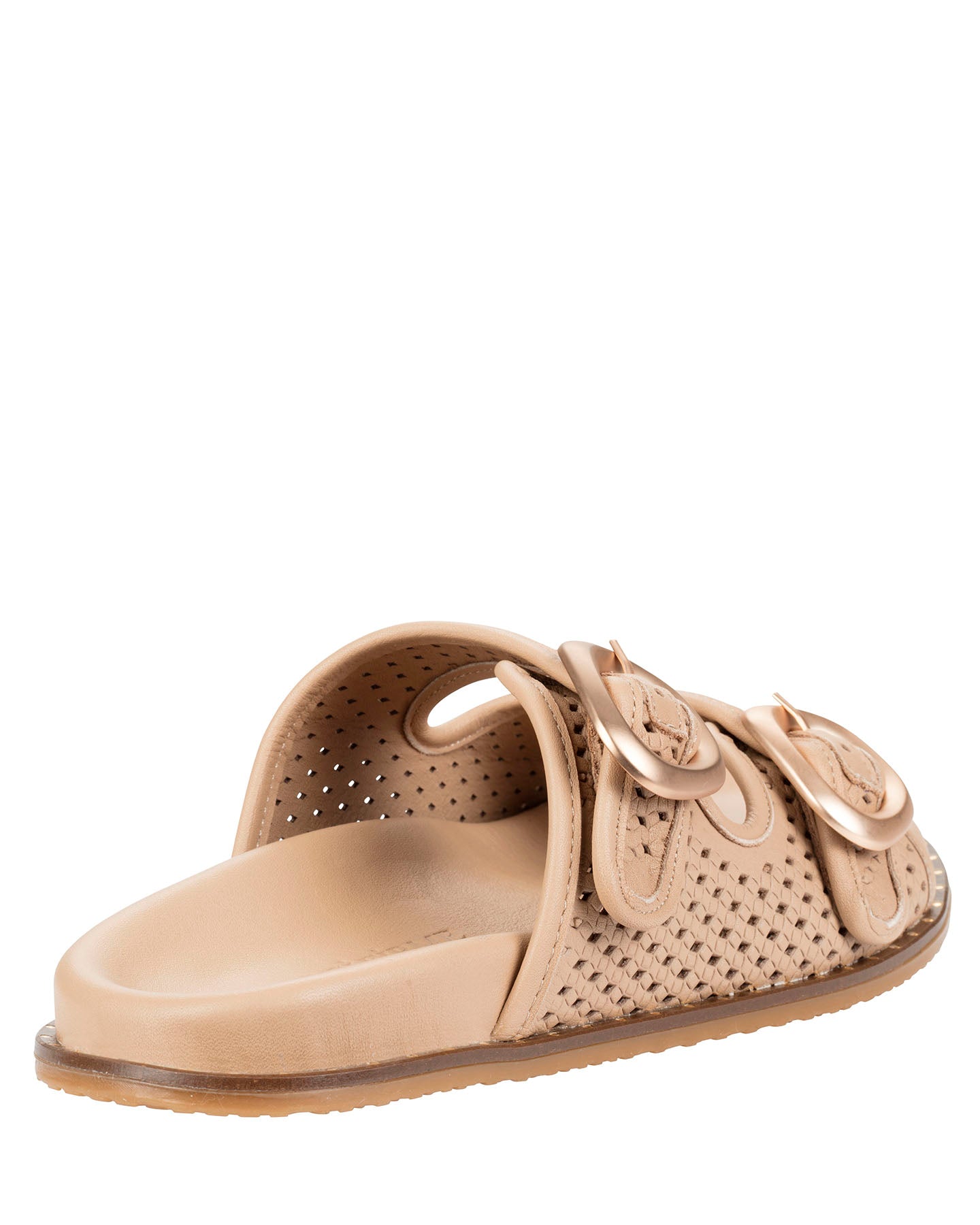 A single tan leather slide sandal with perforated details, featuring three overlapping decorative buckle straps and a contoured footbed, shown from a side angle on a white background.